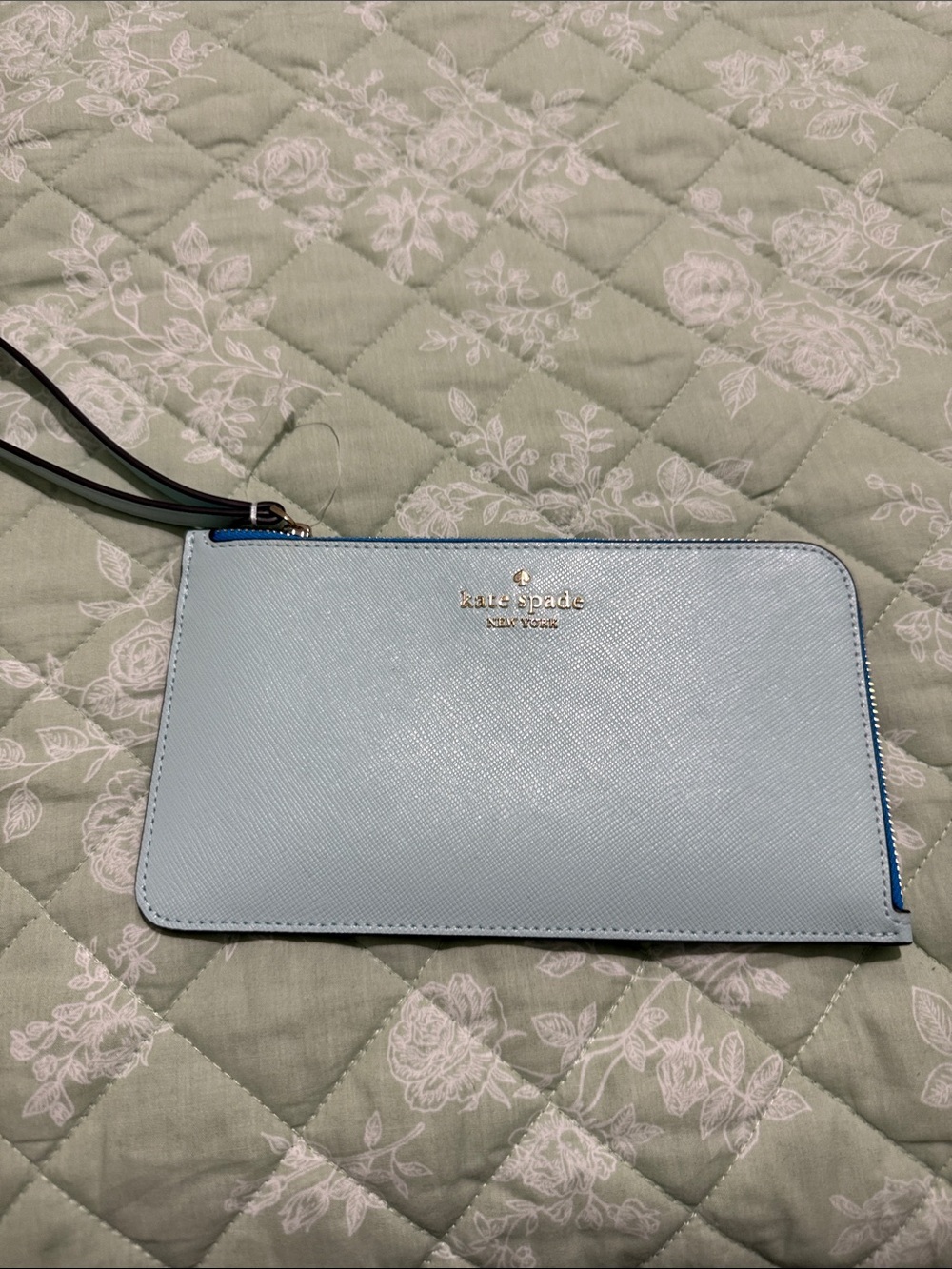 kate spade light blue clutch with gold logo